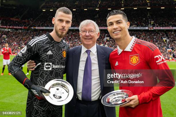 Former Manager Sir Alex Ferguson congratulates Cristiano Ronaldo and David de Gea of Manchester United on their achievements ahead of the Premier...