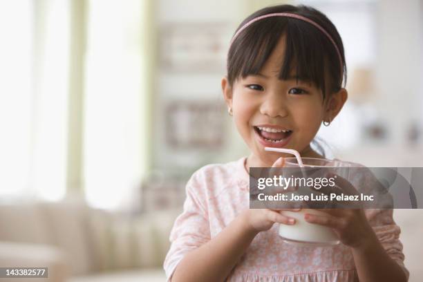 asian girl drinking milk - drinking milk stock pictures, royalty-free photos & images