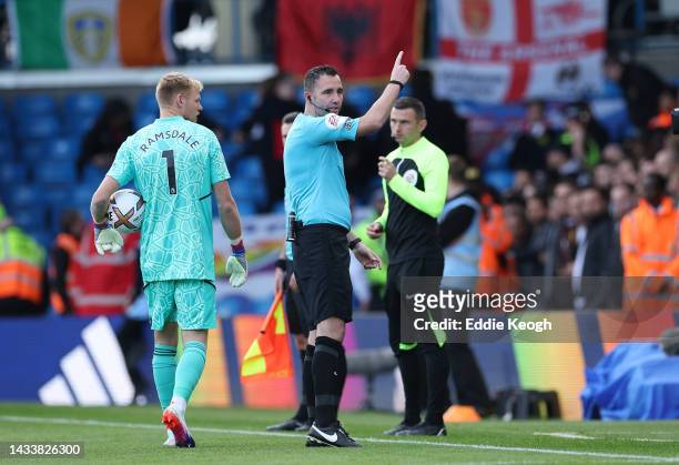 Referee Chris Kavanagh signals for team to enter the tunnel as a power outage causes a delayed kick off at Elland Road during the Premier League...