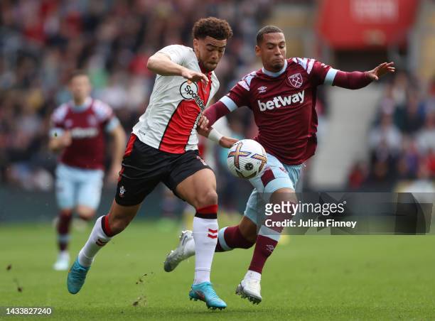 Che Adams of Southampton is challenged by Thilo Kehrer of West Ham United during the Premier League match between Southampton FC and West Ham United...