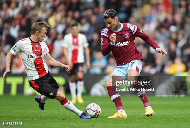 Gianluca Scamacca of West Ham United is challenged by James Ward-Prowse of Southampton during the Premier League match between Southampton FC and...