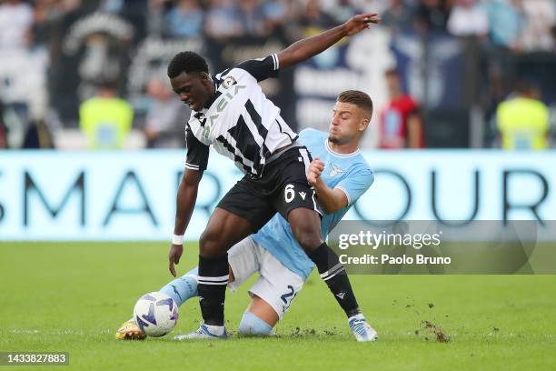 Jean-Victor Makengo of Udinese Calcio is challenged by Sergej Milinkovic-Savic of SS Lazio during the Serie A match between SS Lazio and Udinese...