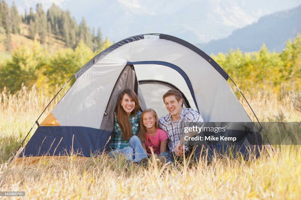 Caucasian family camping together