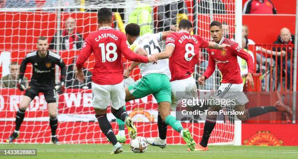 Bruno Fernandes of Manchester United in action with Jacob Murphy of Newcastle United during the Premier League match between Manchester United and...