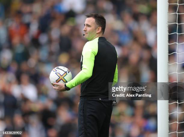 Referee Chris Kavanagh looks on as kick off is delayed due to a technical issue during the Premier League match between Leeds United and Arsenal FC...