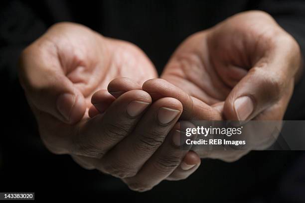 close up of mixed race man's hands - hands cupped empty ストックフォトと画像