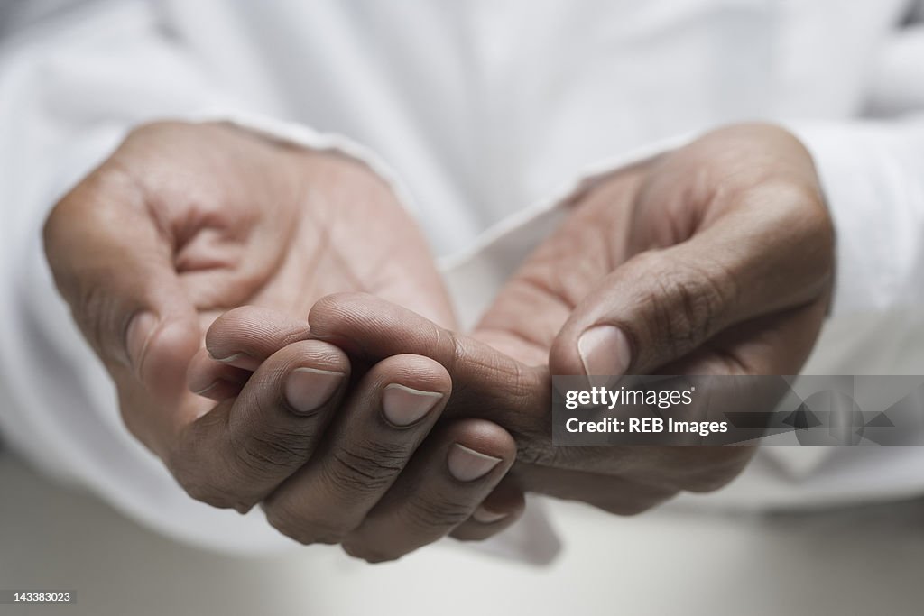 Close up of mixed race man's hands