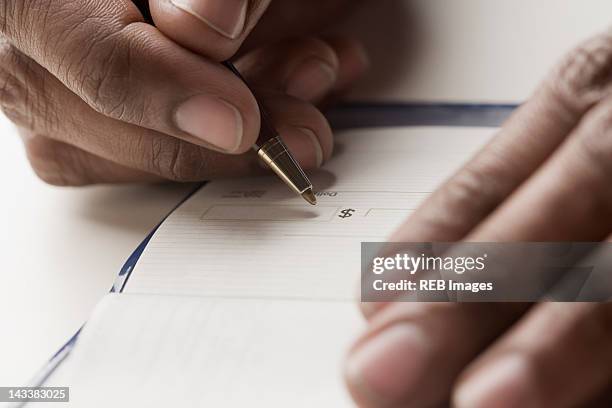 Man Write Check Man Writing A Check Photos and Premium High Res Pictures - Getty Images
