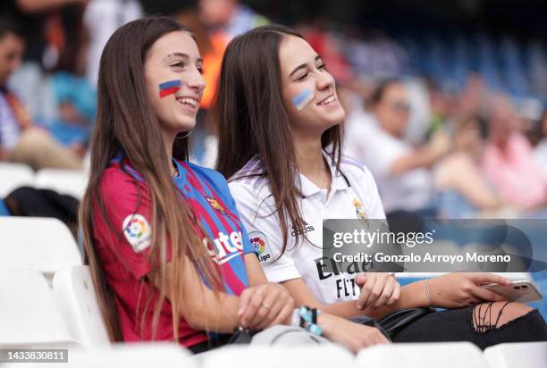 Barcelona and Real Madrid fan pose for a photo prior to the LaLiga Santander match between Real Madrid CF and FC Barcelona at Estadio Santiago...