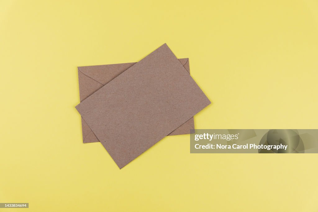 Brown Envelope on Yellow Background