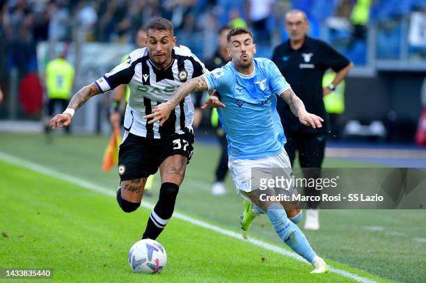 Mattia Zaccagni of SS Lazio compete for the ball with Roberto Pereyra of Udinese Calcio during the Serie A match between SS Lazio and Udinese Calcio...