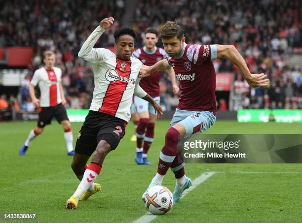 Kyle Walker-Peters of Southampton is challenged by Aaron Cresswell of West Ham United during the Premier League match between Southampton FC and West...