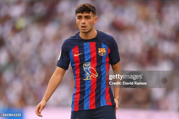 Pedri of FC Barcelona looks on wearing the modified OVO owl logo on the front of the FC Barcelona shirt, which celebrates Canadian musician Drake...