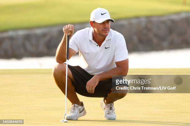 Team Captain Brooks Koepka of Smash GC lines up a putt on the 18th green during day three of the LIV Golf Invitational - Jeddah at Royal Greens Golf...