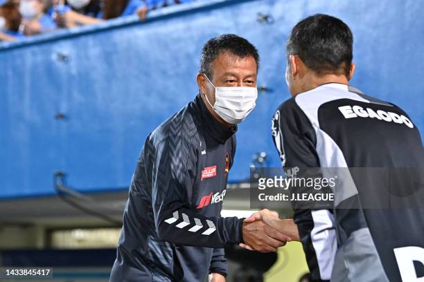 Head coach Masaaki YANAGISHITA of Zweigen Kanazawa and Head coach Shuhei YOMODA of Yokohama FC shake hands prior to the J.LEAGUE Meiji Yasuda J2 41st...