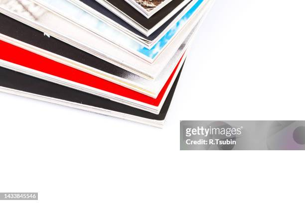 magazines up close shot on white background - paper corner stock pictures, royalty-free photos & images