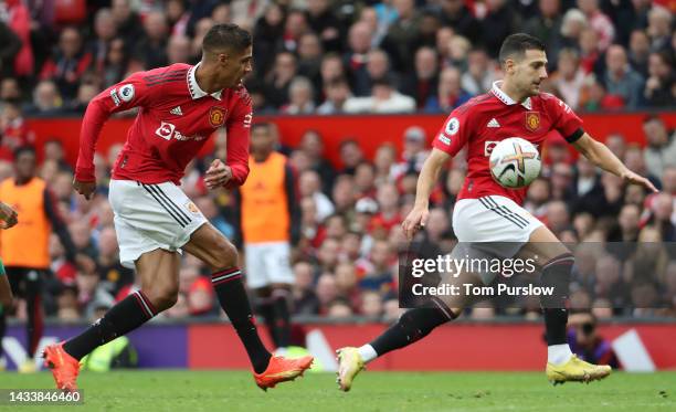 Raphael Varane, Diogo Dalot of Manchester United in action during the Premier League match between Manchester United and Newcastle United at Old...