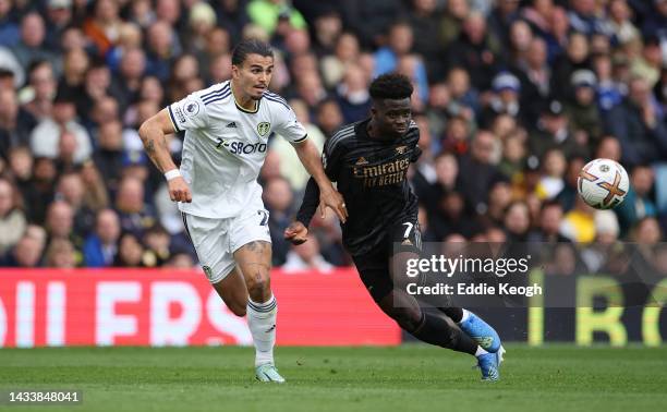 Bukayo Saka of Arsenal wins a header against Pascal Struijk of Leeds United during the Premier League match between Leeds United and Arsenal FC at...