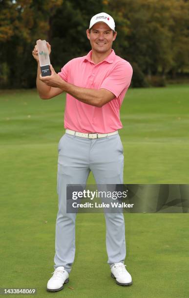 Jeremy Freiburghaus of Switzerland poses with the trophy after winning the English Trophy presented by Rocket Yard Sports Marketing at Frilford Heath...