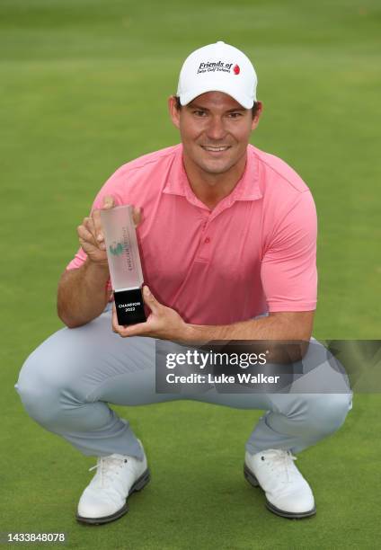 Jeremy Freiburghaus of Switzerland poses with the trophy after winning the English Trophy presented by Rocket Yard Sports Marketing at Frilford Heath...
