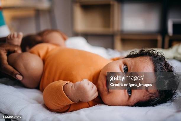 happy little  newborn baby - black baby stockfoto's en -beelden