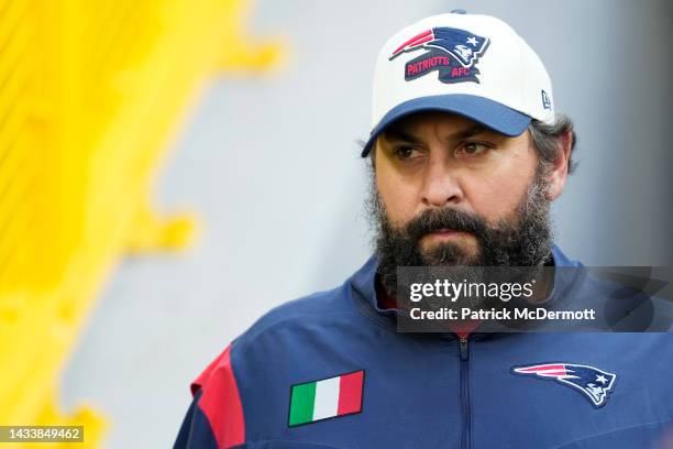 Offensive line coach Matt Patricia of the New England Patriots walks onto the field before a game against the Green Bay Packers at Lambeau Field on...