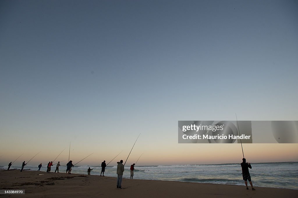 Fishermen surf fishing the morning.