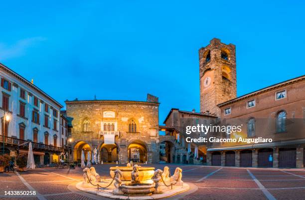 piazza vecchia in the upper town of bergamo at dusk, bergamo, lombardy, italy - bergamo ストックフォトと画像