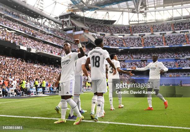 Karim Benzema of Real Madrid celebrates with teammates after scoring their team's first goal during the LaLiga Santander match between Real Madrid CF...