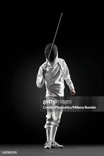 fencers holding up foil, portrait - fechten stock pictures, royalty-free photos & images