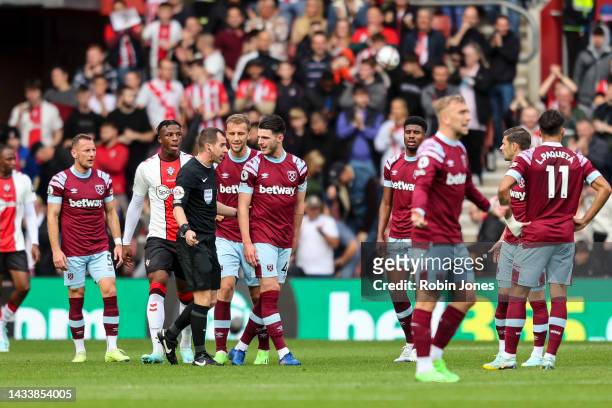 Declan Rice of West Ham United complains to Referee Peter Bankes after Romain Perraud of Southampton scores during the Premier League match between...