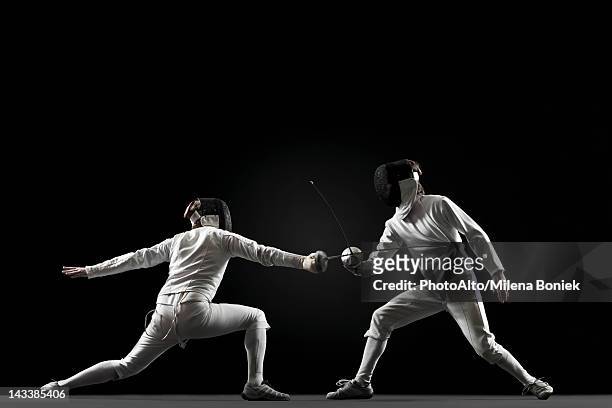 fencers fencing - blocking sports activity stock pictures, royalty-free photos & images