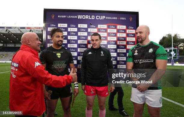 Ashton Golding of Jamaica and George King of Ireland interact alongside Match Referee Ben Casty and Gary Walker at the coin toss ahead of the Rugby...