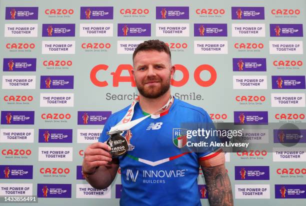 Nathan Brown of Italy poses after being named Player of the Match following the Rugby League World Cup 2021 Pool B match between Scotland and Italy...