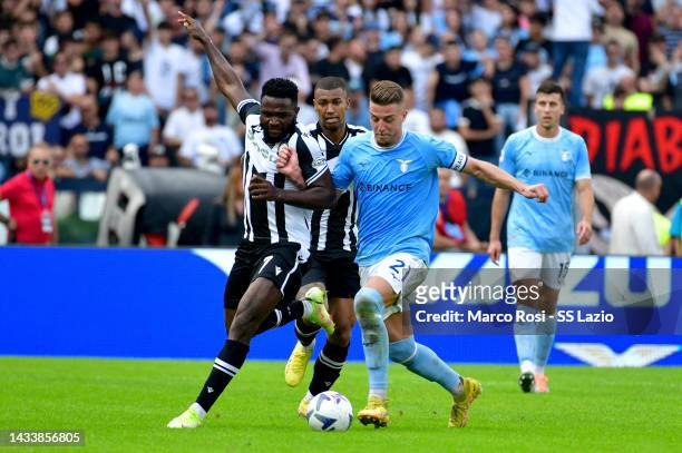 Sergej Milinkovic Savic of SS Lazio compete for the ball with Wallace of Udinese Calcio during the Serie A match between SS Lazio and Udinese Calcio...
