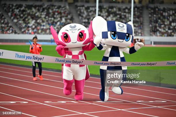 Miraitowa and Someity Mascot of the Tokyo 2020 Olympic break the finishing tape during the "Thank you Tokyo!" Tokyo 2020 Games One Year Anniversary...
