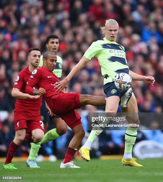 Erling Haaland of Manchester City is challenged by Thiago Alcantara of Liverpool during the Premier League match between Liverpool FC and Manchester...