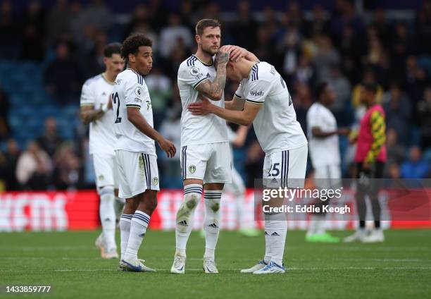 Tyler Adams, Liam Cooper and Rasmus Kristensen of Leeds United looks dejected following their side's defeat in the Premier League match between Leeds...