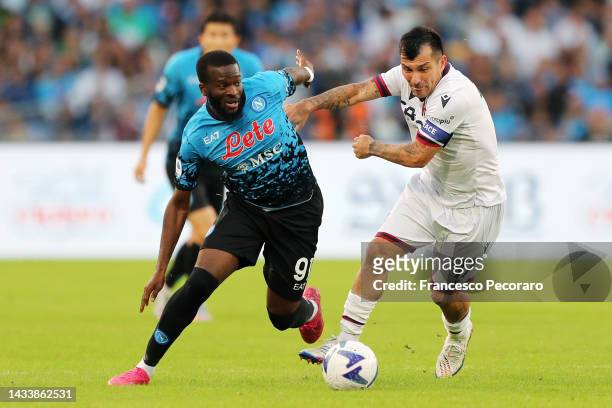 Tanguy Ndombele of SSC Napoli battles for possession with Gary Medel of Bologna FC during the Serie A match between SSC Napoli and Bologna FC at...