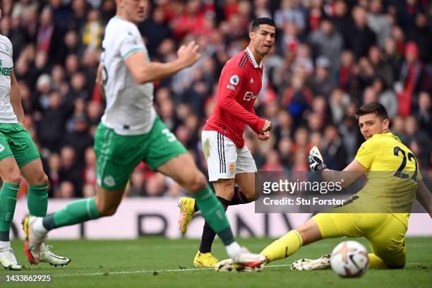 Manchester United striker Cristiano Ronaldo shoots past Nick Pope but the goal is disallowed during the Premier League match between Manchester...