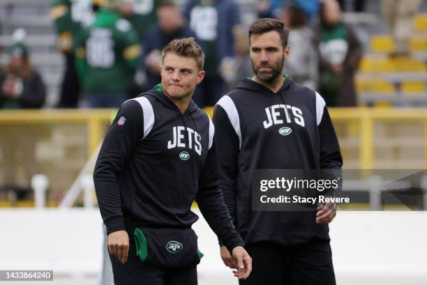 Zach Wilson of the New York Jets and Joe Flacco of the New York Jets look on during pregame at Lambeau Field on October 16, 2022 in Green Bay,...
