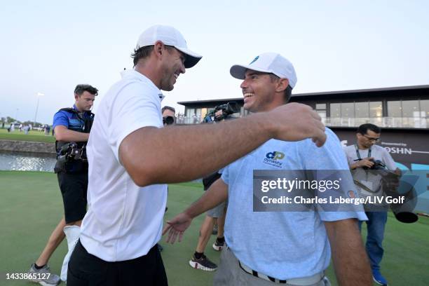 Team Captain Brooks Koepka of Smash GC embraces his brother Chase Koepka of Smash GC after winning on the 18th green, the third playoff hole, during...