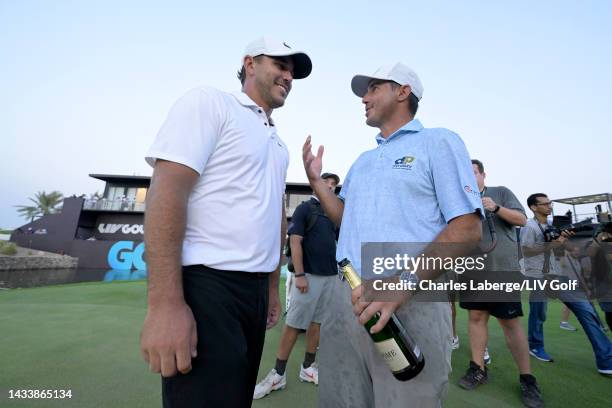 Team Captain Brooks Koepka of Smash GC talks with his brother Chase Koepka of Smash GC after winning on the 18th green, the third playoff hole,...