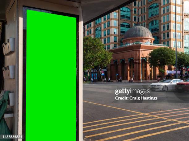 medium size green screen chroma key marketing advertisement billboard in city centre shopping mall, train bus station or airport environment targeting adverts at consumers, retail shoppers, commuters and tourists. - vietnam wall stock pictures, royalty-free photos & images