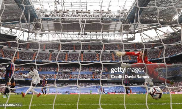 Ferran Torres of FC Barcelona scores their team's first goal past Andriy Lunin of Real Madrid during the LaLiga Santander match between Real Madrid...