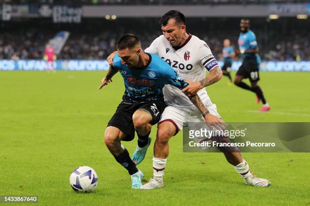 Matteo Politano of SSC Napoli battles for possession with Gary Medel of Bologna FC during the Serie A match between SSC Napoli and Bologna FC at...