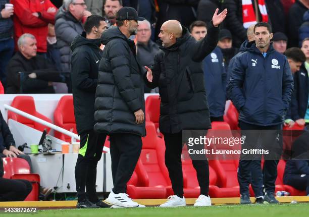 Juergen Klopp, Manager of Liverpool and Pep Guardiola, Manager of Manchester City exchange words during the Premier League match between Liverpool FC...