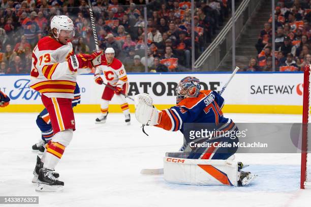 Goaltender Stuart Skinner of the Edmonton Oilers makes a save against Tyler Toffoli of the Calgary Flames during the third period at Rogers Place on...