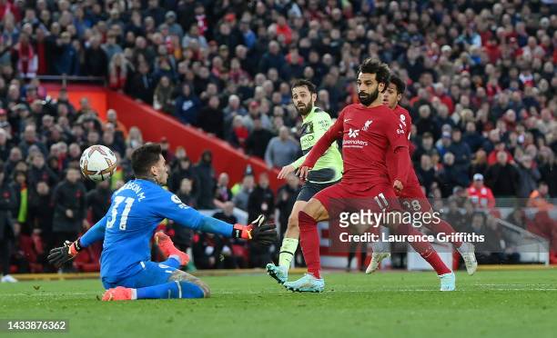 Mohamed Salah of Liverpool scores their side's first goal past Ederson of Manchester City during the Premier League match between Liverpool FC and...