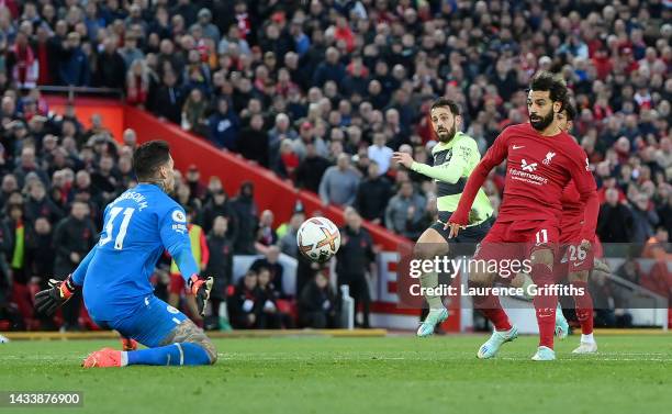 Mohamed Salah of Liverpool scores their side's first goal past Ederson of Manchester City during the Premier League match between Liverpool FC and...